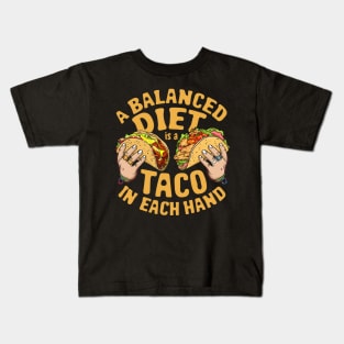 A balanced diet is a taco in each hand Kids T-Shirt